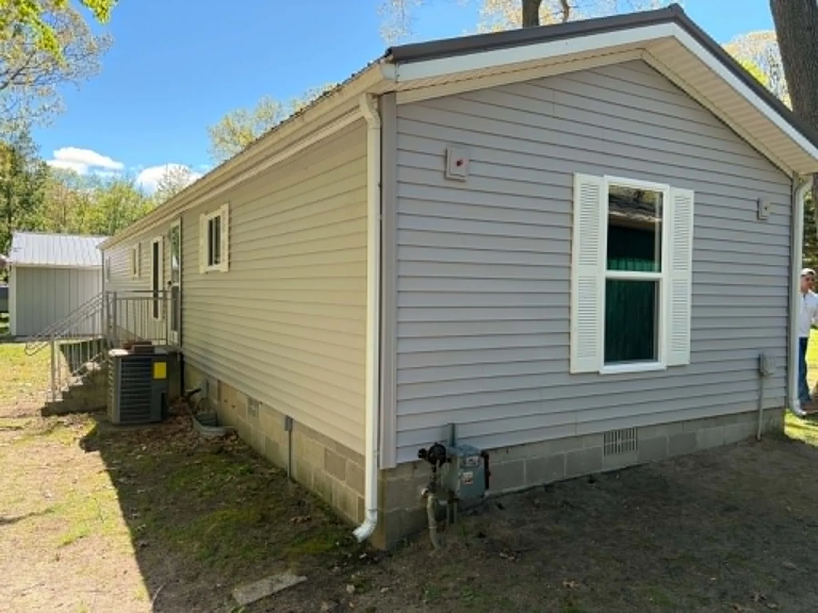 Finished gable-end siding and trim around a replacement window