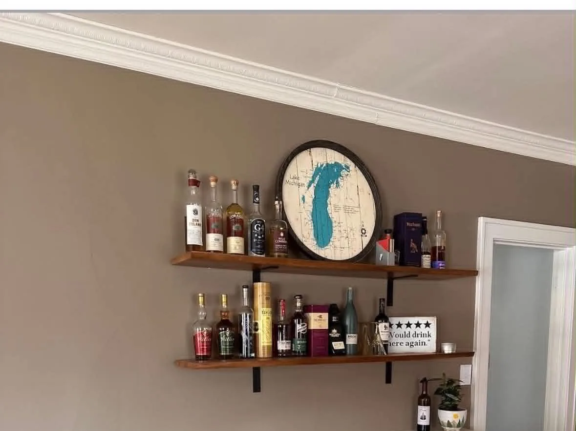 Built-in beverage cabinet and display shelving in a finished living space